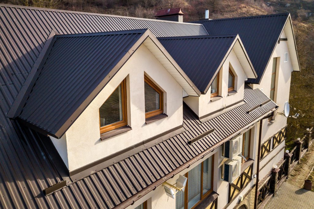 A large home with a standing seam metal roof